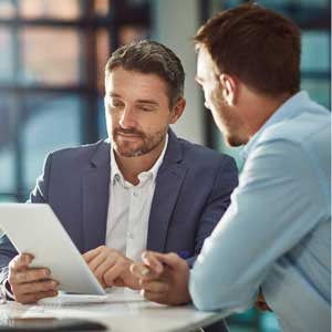 two men in a meeting